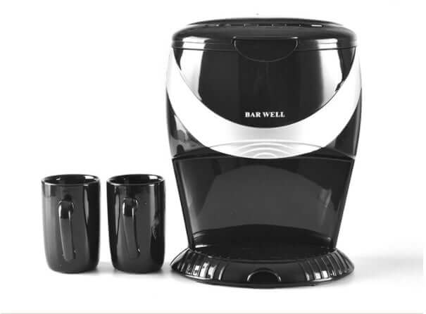 Double cup automatic coffee machine with two black coffee cups beside it.