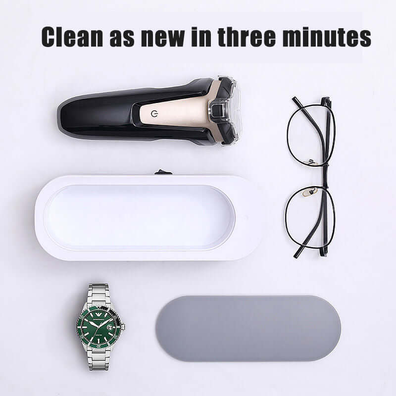 Ultrasonic jewelry cleaner with watch, glasses, and razor, cleaning devices effectively in three minutes.