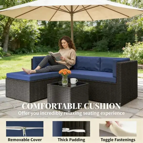 Comfortable outdoor patio furniture set with chic chaise lounge and coffee table in a serene backyard setting.