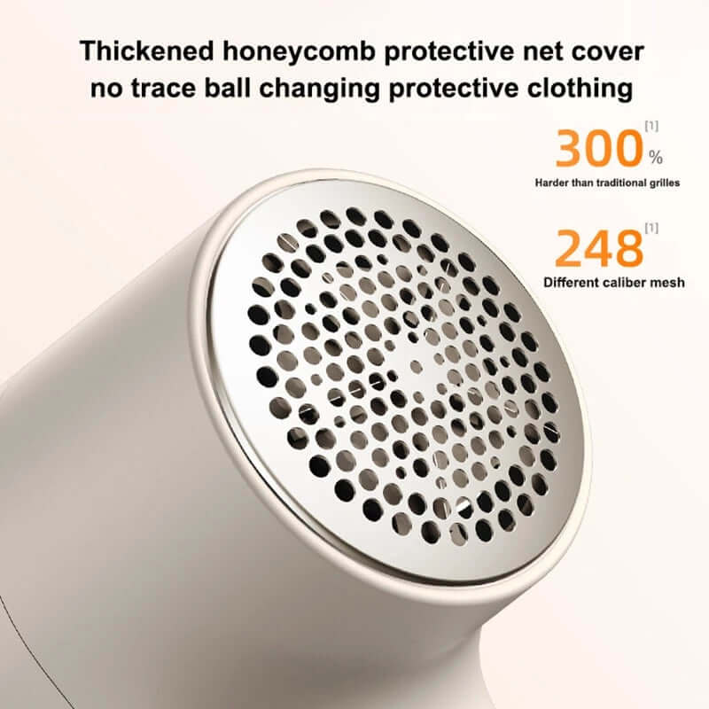 Close-up of electric lint remover with LED display featuring honeycomb protective net and advanced mesh design.