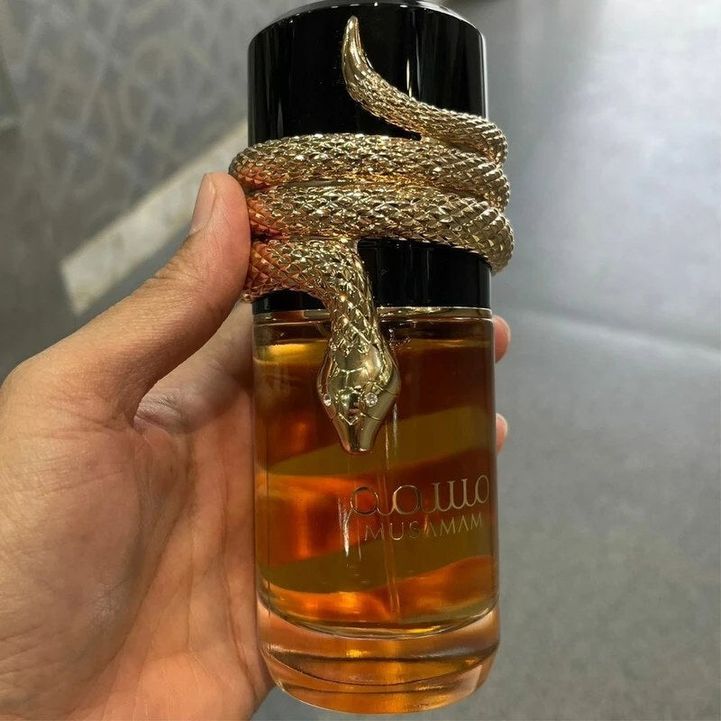 Premium Arabic Musamam Perfume in an elegant atomizer with a unique snake design for men and women.