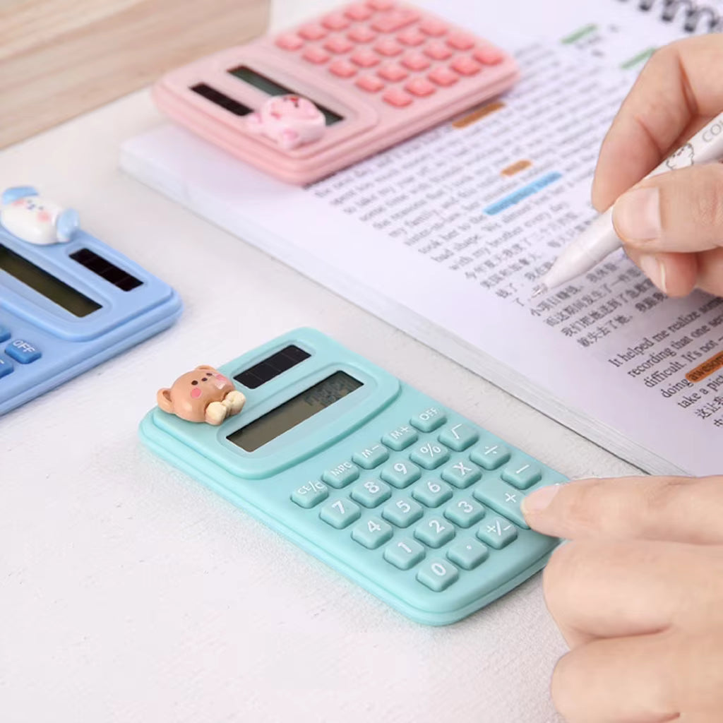 Cute portable mini calculator in light blue, perfect for students and office use, surrounded by other colorful calculators.